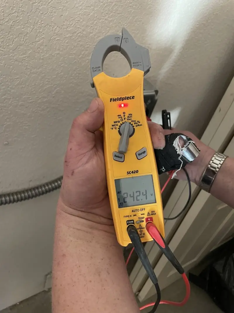 Voltage testing with clamp meter during Outlet Installation in Brewster
